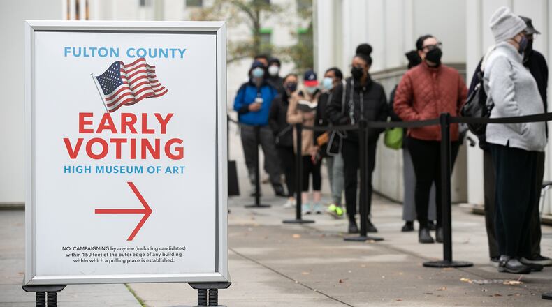 Voters line up for the first day of early voting on Dec. 14, 2020, in Atlanta. (Jessica McGowan/Getty Images/TNS)