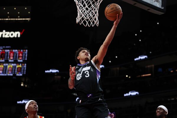 Utah Jazz guard Keyonte George (3) attempts a layup during the second half of an NBA basketball game against the Atlanta Hawks, Sunday, April 6, 2025, in Atlanta. (AP Photo/Colin Hubbard)