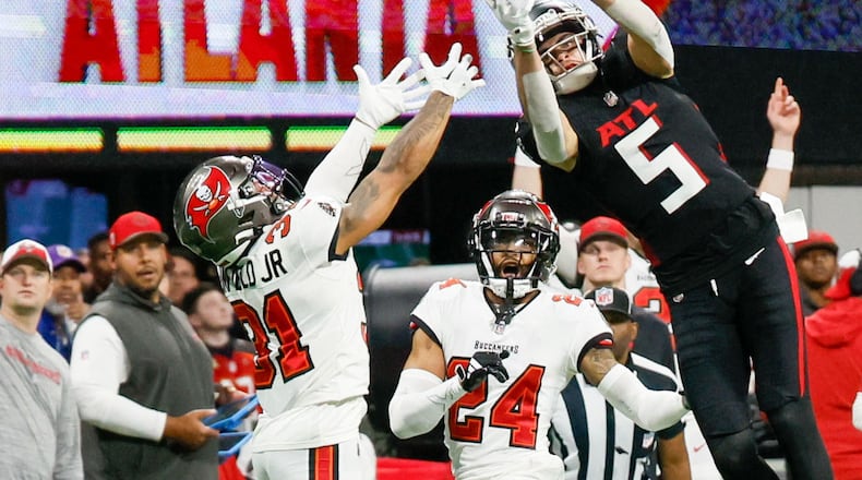 Atlanta Falcons wide receiver Drake London (5) goes up for an impressive reception during the fourth quarter against the Tampa Bay Buccaneers on Sunday, Dec. 10, 2023,  at Mercedes-Benz Stadium in Atlanta. 
Miguel Martinez/miguel.martinezjimenez@ajc.com