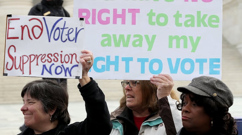 Protesters gather during a rally the group Common Cause held in front of the U.S. Supreme Court in January. Voting rights activists rallied to oppose voter roll purges as the Supreme Court heard oral arguments in the case Husted v. A Philip Randolph Institute, a challenge to Ohio’s voter roll purges. (Photo by Win McNamee/Getty Images)