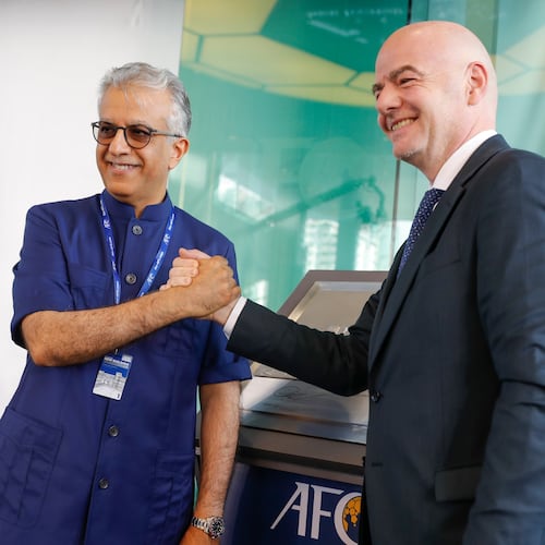 FILE - Asia Football Confederation President Salman Bin Ibrahim Al-Khalifa, left, poses with FIFA President Gianni Infantino during an inauguration ceremony for the new building of the Asia Football Confederation in Kuala Lumpur, Malaysia Tuesday, Oct. 30, 2018. (AP Photo/Vincent Thian, File)