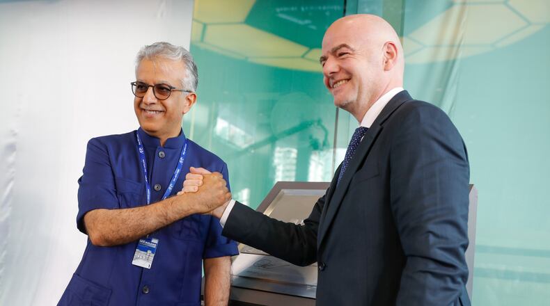 FILE - Asia Football Confederation President Salman Bin Ibrahim Al-Khalifa, left, poses with FIFA President Gianni Infantino during an inauguration ceremony for the new building of the Asia Football Confederation in Kuala Lumpur, Malaysia Tuesday, Oct. 30, 2018. (AP Photo/Vincent Thian, File)