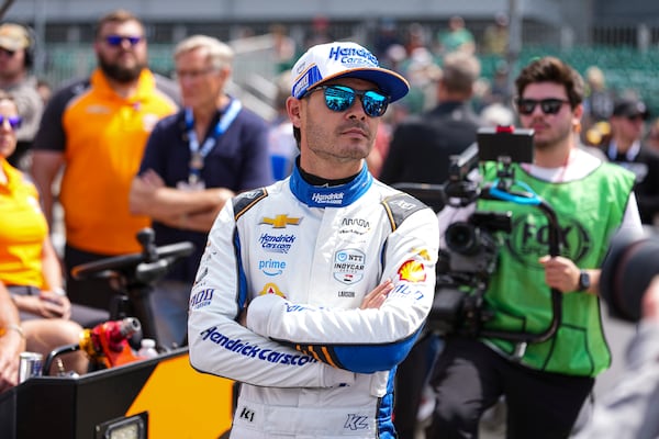 Kyle Larson watches as he waits for is turn during qualification for the Indianapolis 500 auto race at Indianapolis Motor Speedway in Indianapolis, Saturday, May 17, 2025. (AP Photo/Michael Conroy)