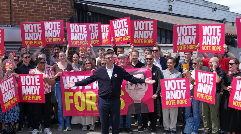 Britain's Labour candidate Andy Burnham stands in front of supporters during the by-election in Makerfield, England, Thursday, June 18, 2026 where voters are choosing a new lawmaker with Andy Burnham of the Labour Party as the leading contender.(AP Photo/Jon Super)