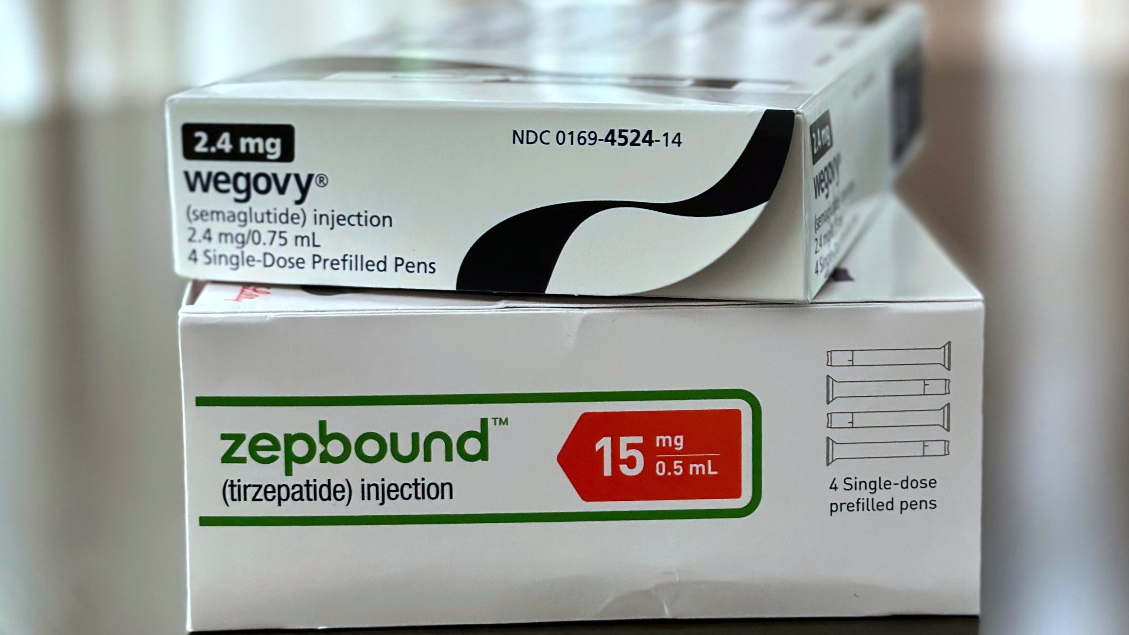 FILE - Boxes for the medications Wegovy and Zepbound are arranged for a photograph in California on May 8, 2025. (AP Photo/JoNel Aleccia, File)