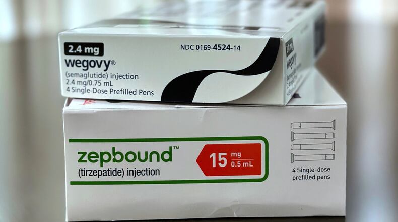 FILE - Boxes for the medications Wegovy and Zepbound are arranged for a photograph in California on May 8, 2025. (AP Photo/JoNel Aleccia, File)