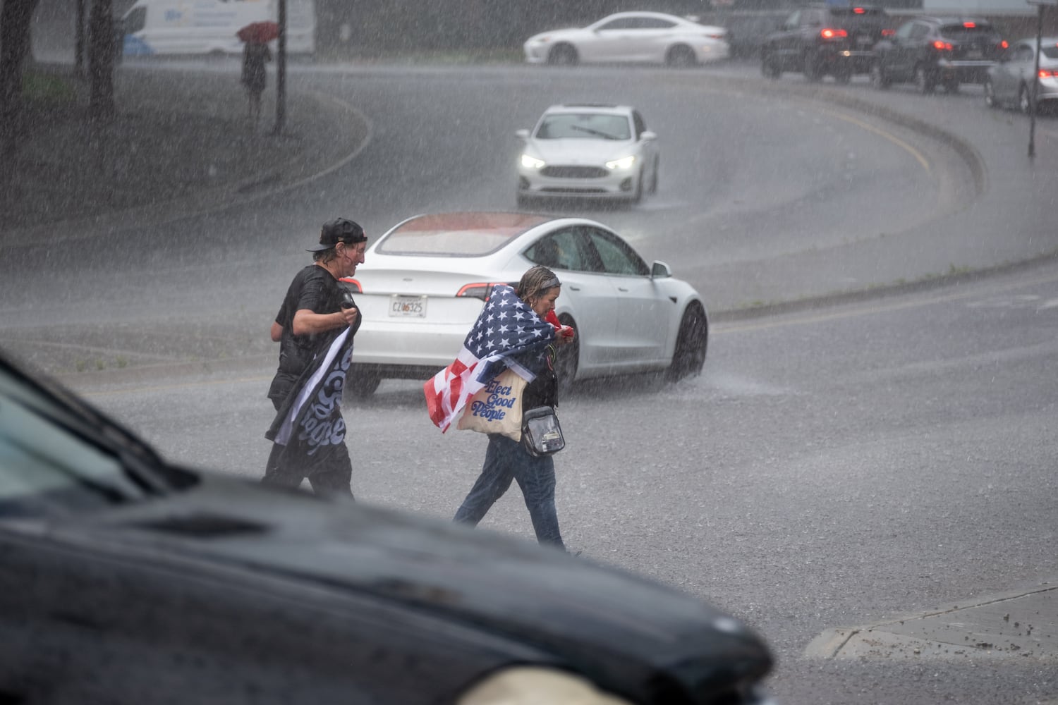 People make their way from the 17th Street bridge in Atlanta following part of the nation-wide No Kings protests Saturday, June 14, 2025.   Ben Gray for the Atlanta Journal-Constitution