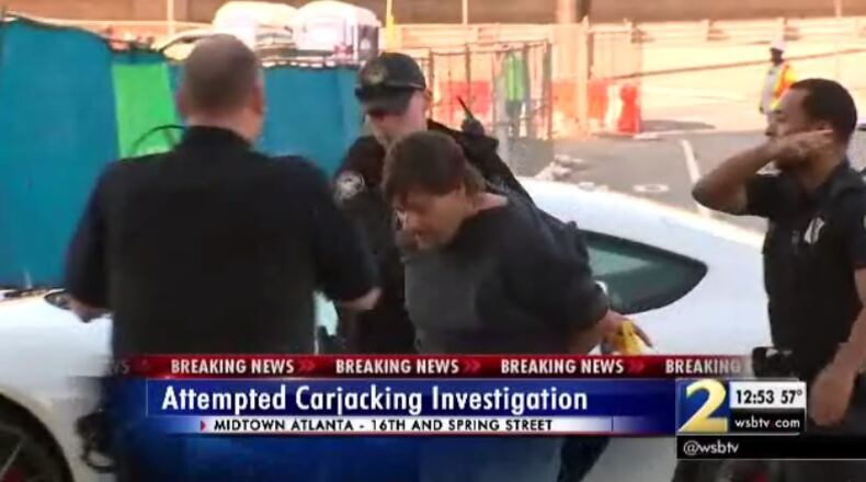 Police lead away a man who allegedly attempted a carjacking in Midtown on Thursday. (Credit: Channel 2 Action News)