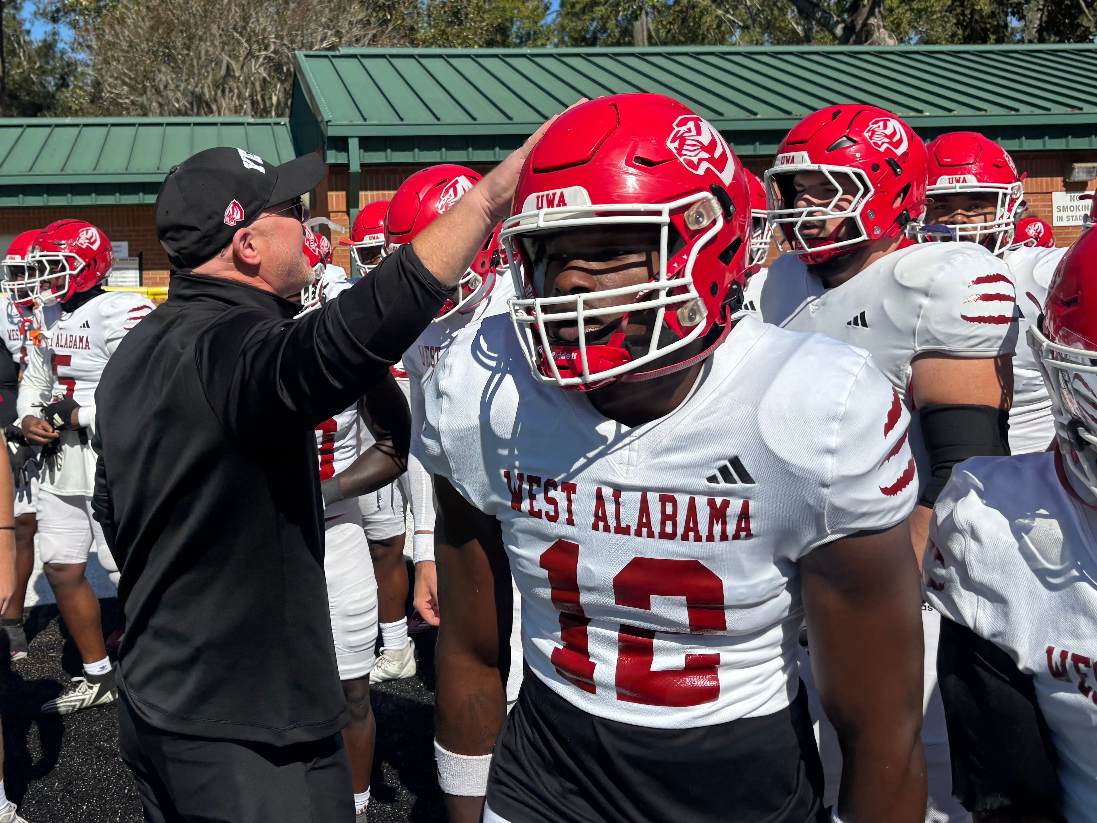 Scott Cochran leads his West Alabama team out onto the field to face Valdosta State on Nov. 1, 2025 (Jack Leo/AJC).