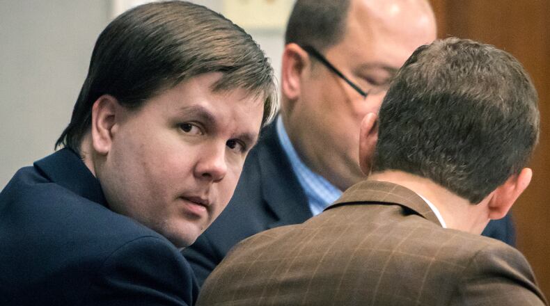 Justin Ross Harris speaks with attorney Carlos Rodriguez in the courtroom during his murder trial, Thursday, Nov. 10, 2016, in Brunswick, Ga. (Stephen B. Morton/Atlanta Journal-Constitution via AP, Pool)