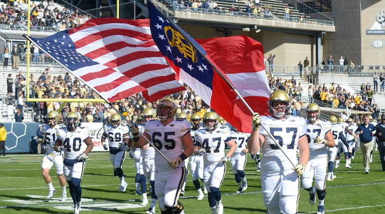 The Georgia Tech Yellow Jackets take the field at the start of their game against the Virginia Cavaliers at Bobby Dodd Stadium Saturday, November 19, 2016. SPECIAL/Daniel Varnado