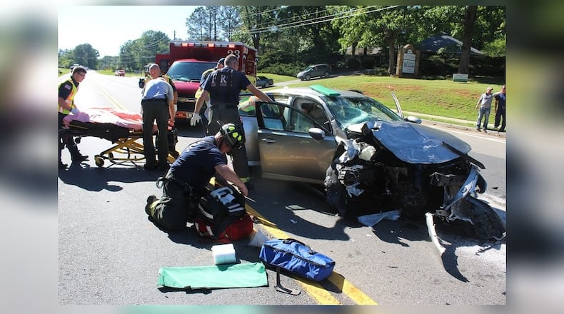 Five people, including two children, were injured in a crash off Ga. 20 on Tuesday afternoon. (Credit: Cherokee County Fire and Emergency Services)