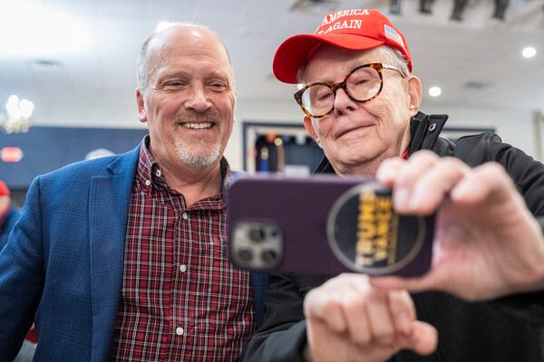 Wisconsin Supreme Court candidate Brad Schimel takes a photo with a supporter at a rally Saturday, March 29, 2025 on a campaign stop at the American Serb Memorial Hall in Milwaukee. (AP Photo/Andy Manis)