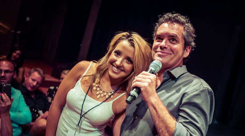 Brian Howie hugs and audience member during a Great Love Debate live show in Laguna.