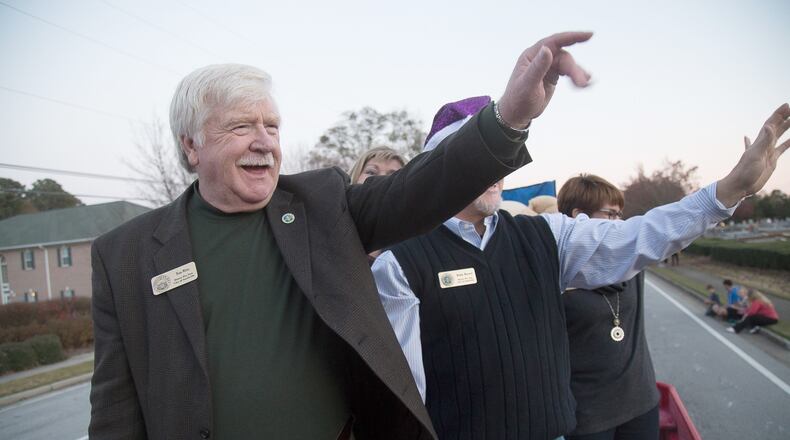 In this 2015 file photo, Snellville Mayor Tom Witts rides with city council members during the city's Christmas parade. STEVE SCHAEFER / SPECIAL TO THE AJC