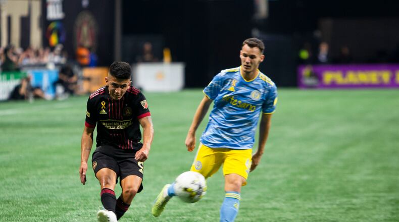 Thiago Almada, midfielder for Atlanta United, passes the ball with pressure from Philadelphia Union midfielder Dániel Gazdag during the Philadelphia Union vs. Atlanta United soccer game on Saturday, September 17, 2022, at Mercedes Benz Stadium in Atlanta. Atlanta United tied Philadelphia Union 0-0. CHRISTINA MATACOTTA FOR THE ATLANTA JOURNAL-CONSTITUTION.