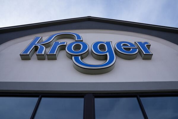 FILE - A sign is affixed to the exterior of a Kroger grocery store in Monroe, Ohio, in this undated photo. (AP Photo/Jeff Dean, File)