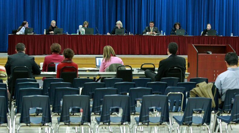 The Fulton County School Board conducts their meeting in the cafeteria of Dunwoody Springs Elementary Thursday evening Sandy Springs, Ga., November 21, 2013. Fulton County School Board Members discussed where to hold meetings in light of recent criticism from county commissioners. JASON GETZ / JGETZ@AJC.COM