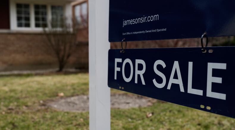 A House For Sale sign is displayed in front of a home in Evanston, Ill.,Wednesday, March 25, 2026. (AP Photo/Nam Y. Huh)