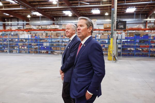 Mark Rayfield, Saint-Gobain North America CEO takes a tour of Saint-Gobain roofing factory with Gov. Brian Kemp in Peachtree City on Friday, Feb. 13, 2026. The company recently underwent an expansion of the facility. (Natrice Miller/AJC)