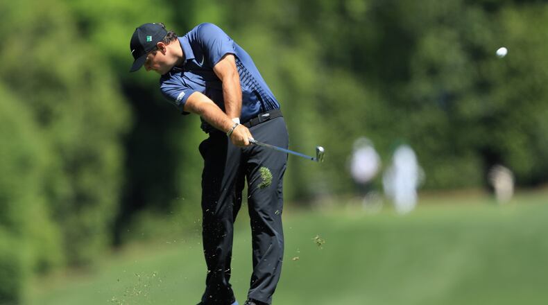 Patrick Reed plays his second shot on the fifth hole during the first round of the 2018 Masters Tournament.  (Photo by David Cannon/Getty Images)