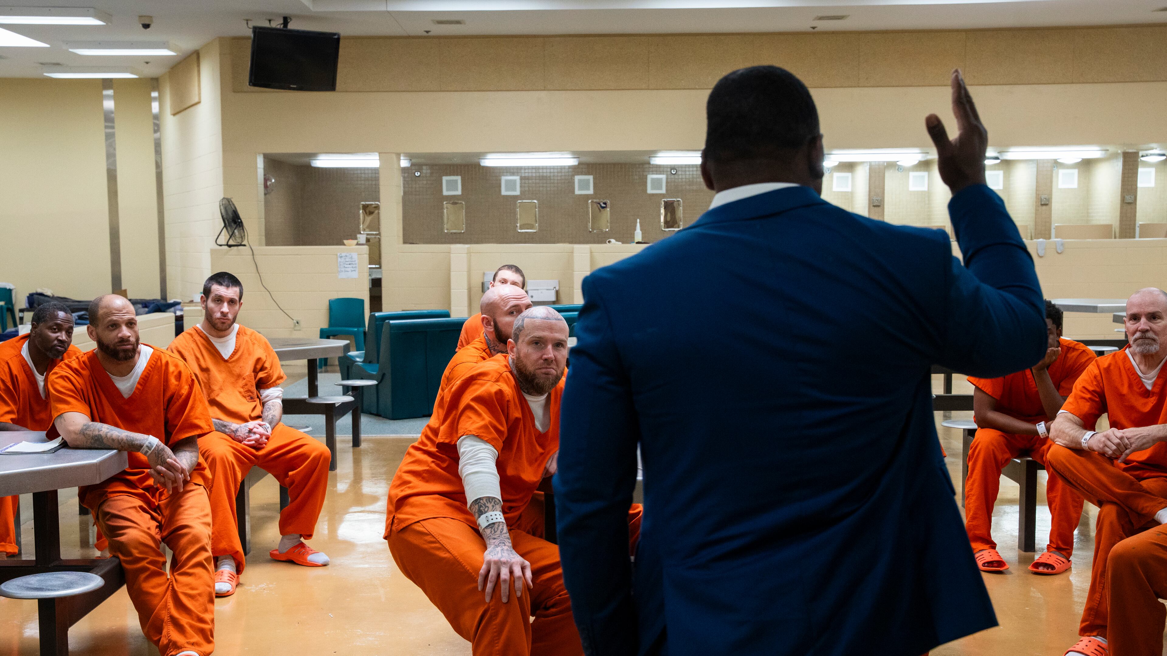 Inmates listen intently as Shane Sims guides a discussion at the Athens-Clarke County Jail on Wednesday, May 14, 2025. “My goal,” he says, “is not to change who you are, but to give you tools to restructure what you are.” (Olivia Bowdoin for the AJC)