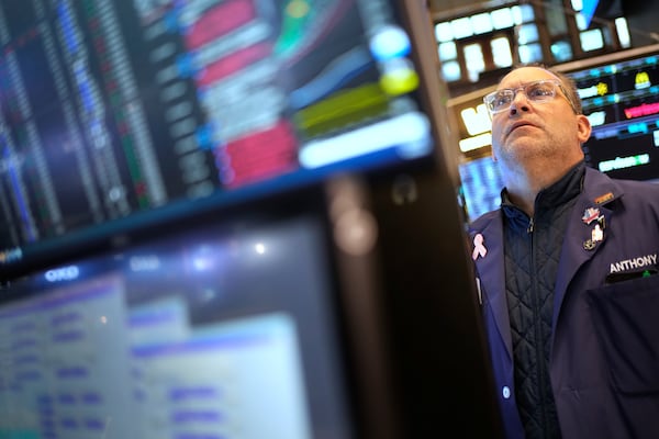 Anthony Matesic works on the floor at the New York Stock Exchange in New York, Wednesday, April 30, 2025. (AP Photo/Seth Wenig)