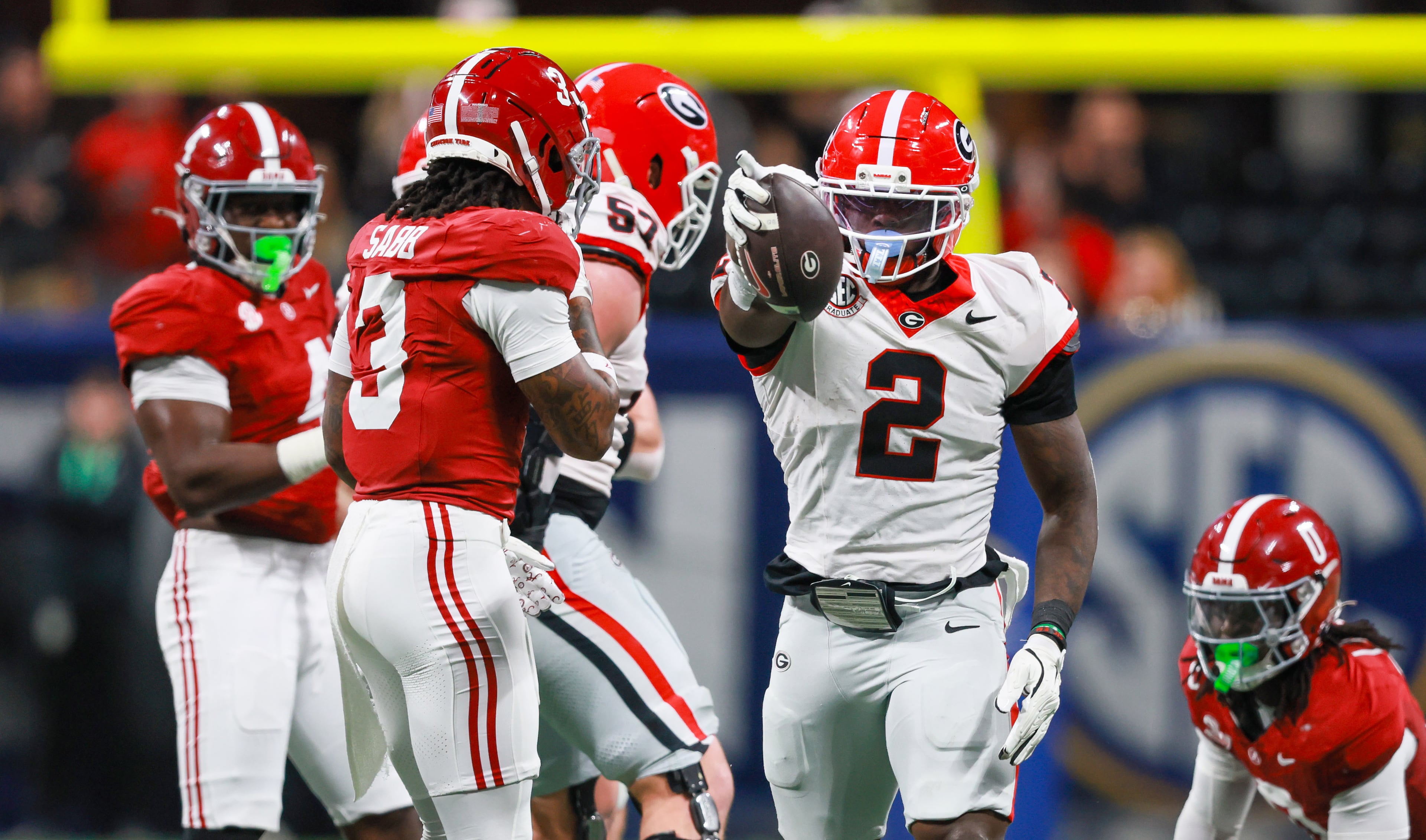 Georgia running back Josh McCray (2) signals a first down against Alabama during the second quarter of the SEC Championship game at Mercedes-Benz Stadium, Saturday, Dec. 6, 2025, in Atlanta. (Jason Getz / AJC)