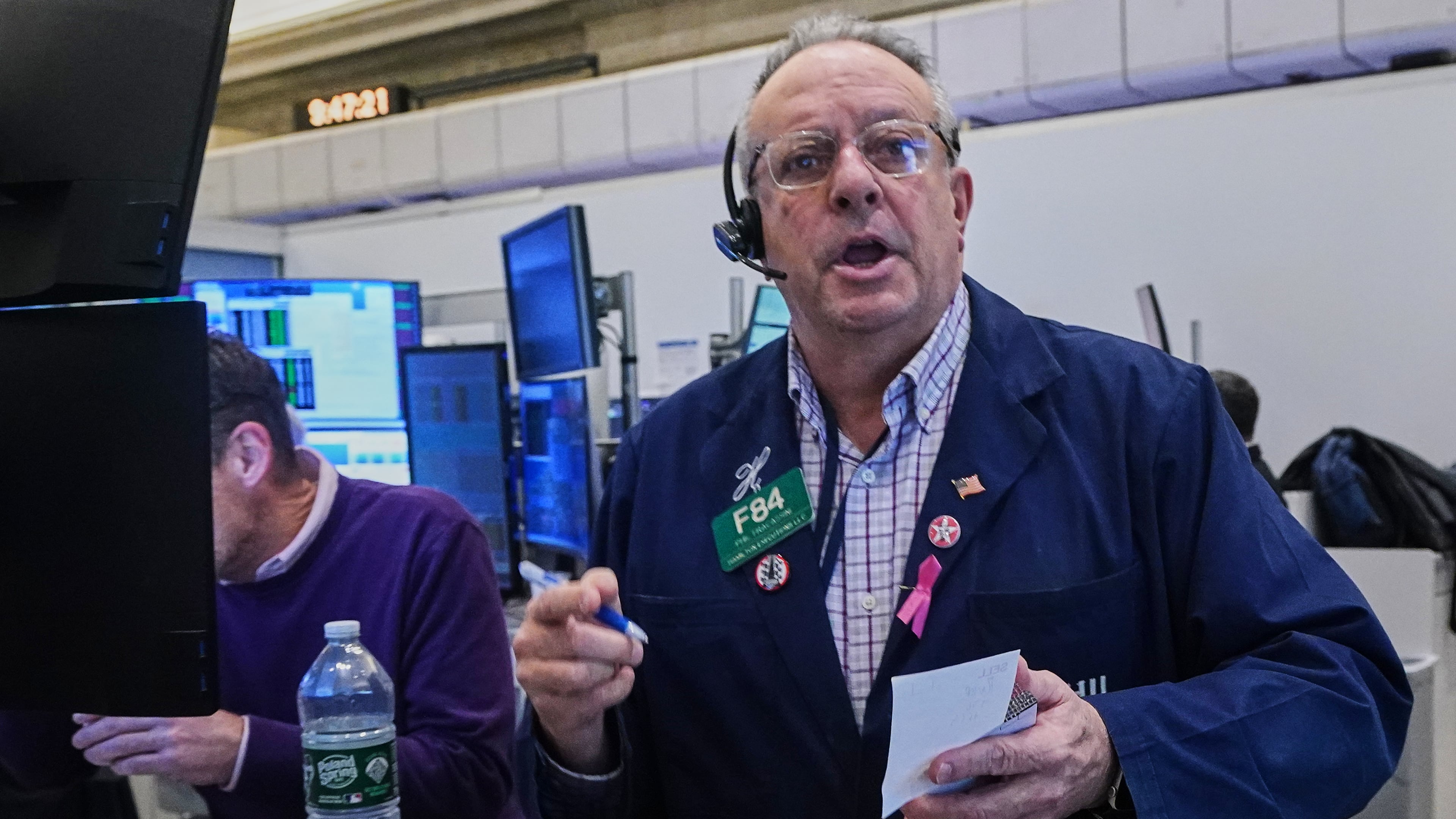 Options trader Phil Fracassini works on the floor of the New York Stock Exchange, Thursday, Nov. 20, 2025. (AP Photo/Richard Drew)