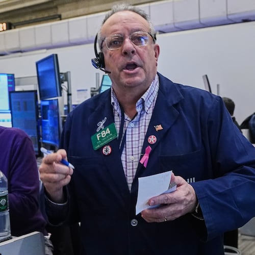 Options trader Phil Fracassini works on the floor of the New York Stock Exchange, Thursday, Nov. 20, 2025. (AP Photo/Richard Drew)