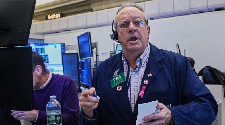 Options trader Phil Fracassini works on the floor of the New York Stock Exchange, Thursday, Nov. 20, 2025. (AP Photo/Richard Drew)