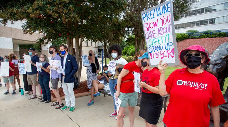 Georgia State University professor Wendy Simonds (R), along with faculty and staff, protest for stronger COVID-19 safety protocols  Monday, August 30, 2021.  STEVE SCHAEFER FOR THE ATLANTA JOURNAL-CONSTITUTION
