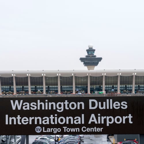 FILE - A sign of Washington Dulles International Airport station is seen during the opening of new Silver Line Extension at Washington Dulles International Airport, in Chantilly, Va., Nov. 15, 2022. (AP Photo/Jose Luis Magana, File)