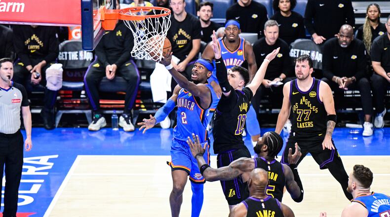 Oklahoma City Thunder guard Shai Gilgeous-Alexander (2) shoots against Los Angeles Lakers forward Jake LaRavia (12) during the second half of an NBA basketball game Thursday, April 2, 2026, in Oklahoma City. (AP Photo/Gerald Leong)