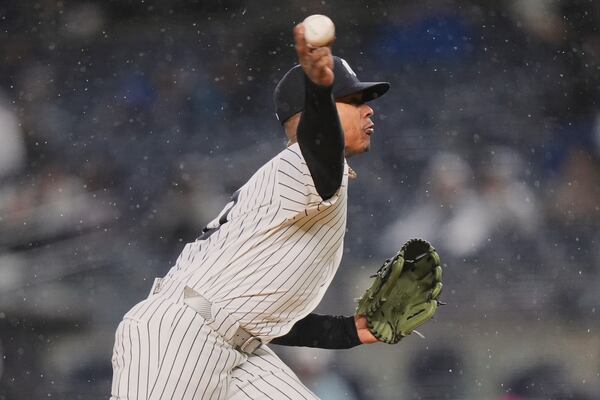New York Yankees' Marcus Stroman pitches during the first inning of a baseball game against the San Francisco Giants Friday, April 11, 2025, in New York. (AP Photo/Frank Franklin II)