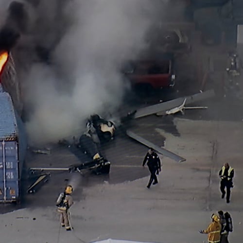 In this still image provided by KABC-TV shows first responders work the scene after a helicopter crashed near a bus crash in Chatsworth, a neighborhood in Los Angeles, Tuesday, Sept. 15, 2026. (KABC-TV via AP)