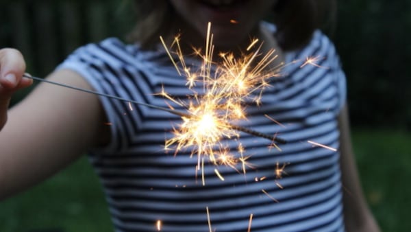 A child plays with sparklers on Memorial Day in 2017.