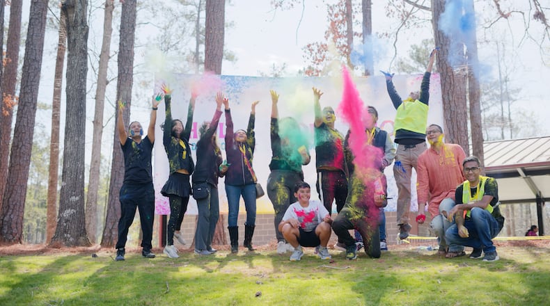 Throwing colored powder is one of the highlights of Dunwoody’s Holi festival. (Courtesy of Boon Vong)