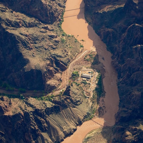 Bright Angel Canyon, damaged by flash floods, runs into the Colorado River in the Grand Canyon, Monday, Aug. 31, 2026, at Grand Canyon National Park, Ariz. (AP Photo/John Locher)