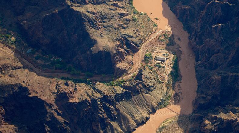 Bright Angel Canyon, damaged by flash floods, runs into the Colorado River in the Grand Canyon, Monday, Aug. 31, 2026, at Grand Canyon National Park, Ariz. (AP Photo/John Locher)