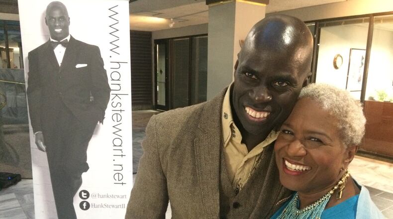 Poet, performer and community activist Hank Stewart with longtime local broadcaster Monica Pearson. JENNIFER BRETT / JBRETT@AJC.COM