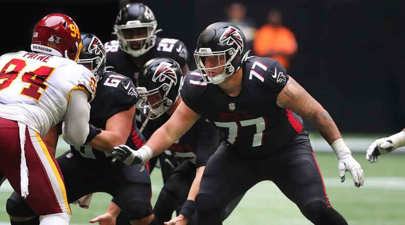 Falcons rookie offensive lineman Jalen Mayfield looks to block for Matt Ryan against the Washington Football Team in the fourth quarter Sunday, Oct. 3, 2021, at Mercedes-Benz Stadium in Atlanta. (Curtis Compton / Curtis.Compton@ajc.com)