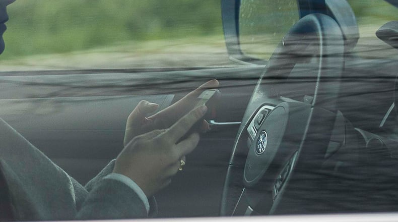 The Georgia State Patrol has issued nearly 50,000 citations since the Hands-Free Georgia Act took effect two years ago. (ALYSSA POINTER/ALYSSA.POINTER@AJC.COM)