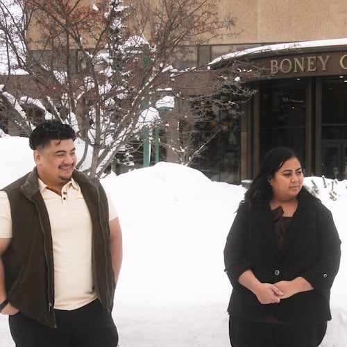 FILE - Michael Pese and his wife Tupe Smith stand outside the Boney Courthouse in Anchorage, Alaska, on Jan. 15, 2026. (AP Photo/Mark Thiessen, File)