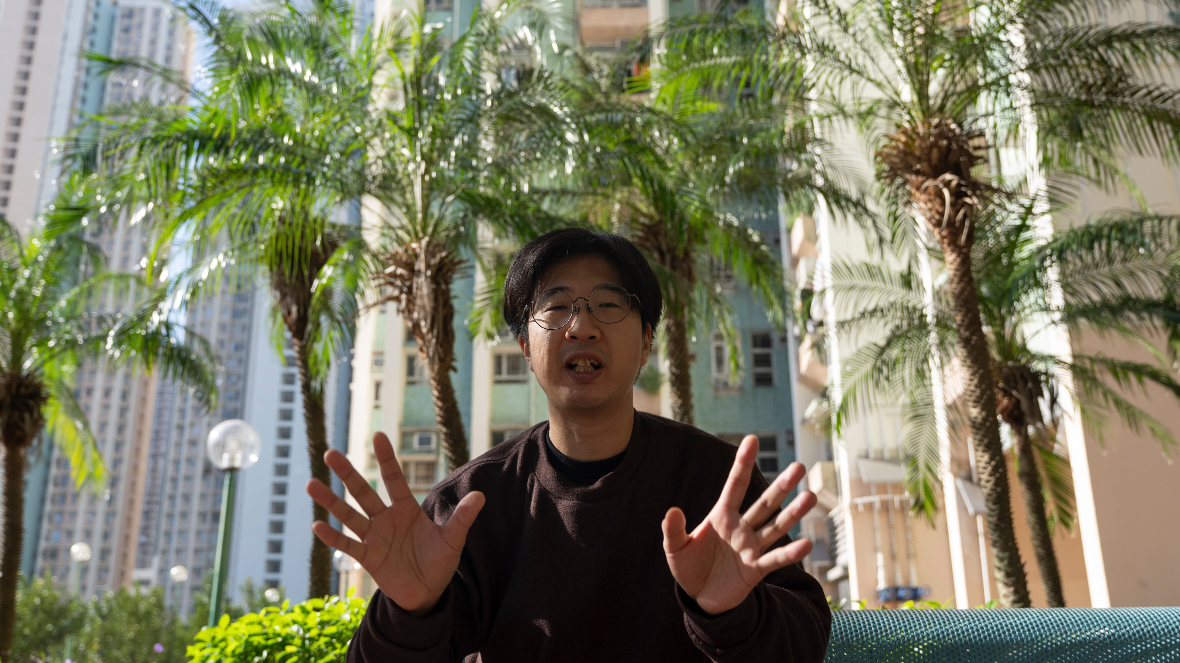 William Li describes his escape from the deadly Nov. 26 fire that destroyed his home at Wang Fuk Court, a residential estate in the Tai Po district, Hong Kong on Saturday, Nov. 29, 2025. (AP Photo/Ng Han Guan)