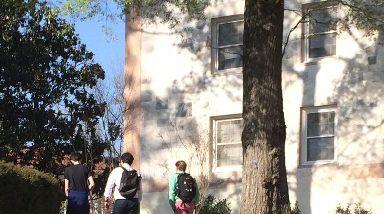 Some in support of Trump has Emory University up in arms. A Trump supporter wrote messages in chalk on the campus last week. An opponent apparently added “STOP” in front of “TRUMP 2016.” Photo by Bill Torpy