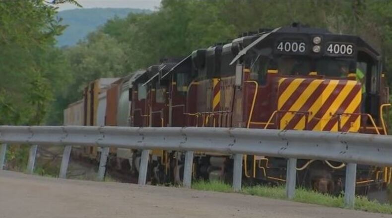 A 19-year-old girl wearing earbuds was injured when she was hit by a train Thursday.
