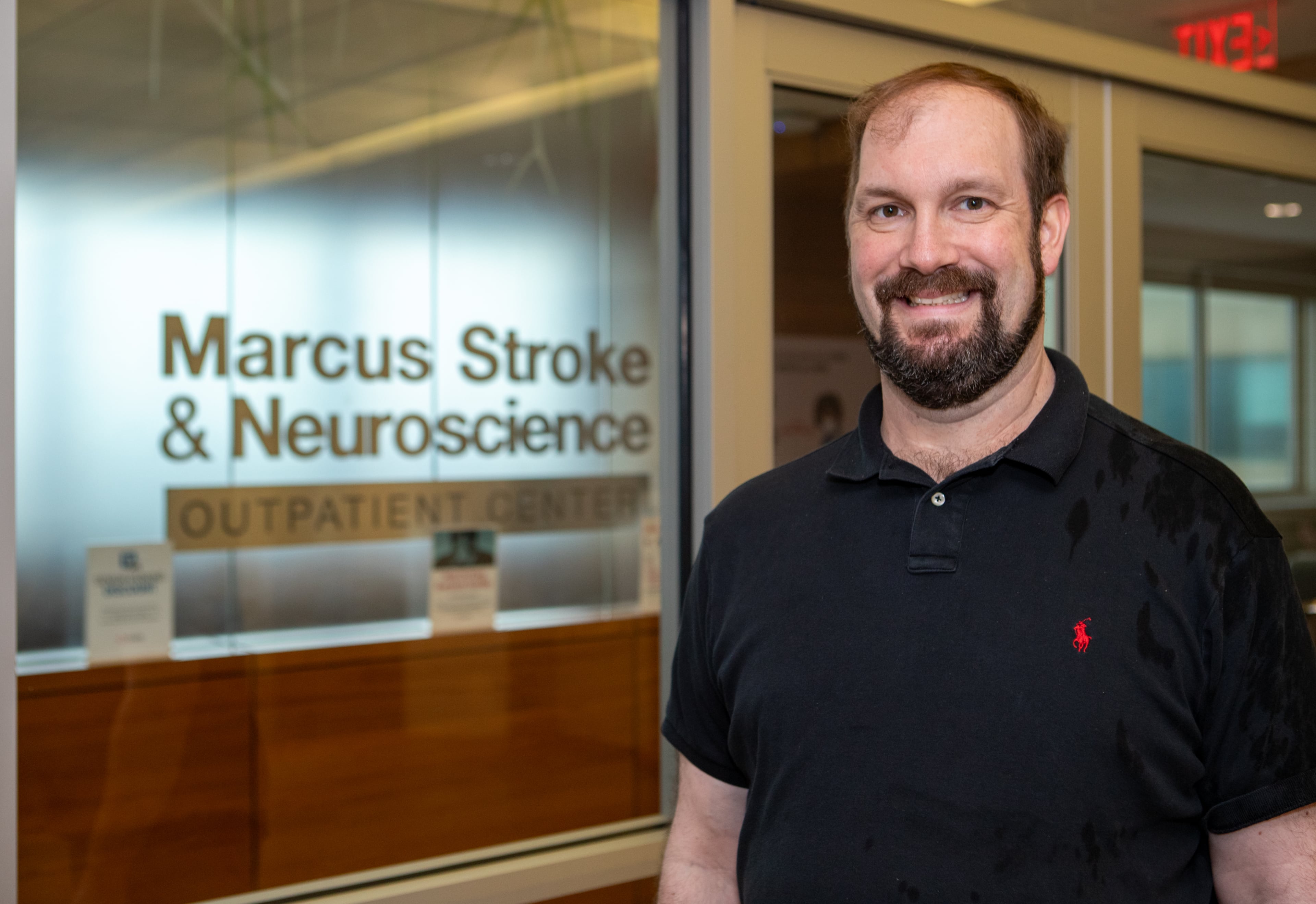 Jon Clark had to learn how to walk again after suffering an aneurysm. (Jenni Girtman for the AJC).
