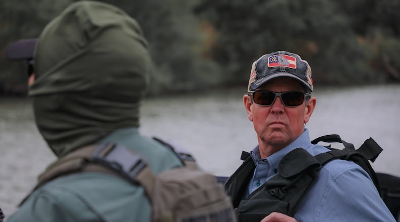 Brian Kemp surveys the Rio Grande River during an April 30, 2021 visit.