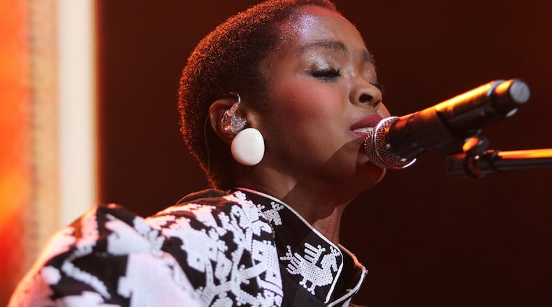 Lauryn Hill performs in September 2015 at One MusicFest at Aaron’s Amphitheater at Lakewood in Atlanta. She, along with the Fugees, will come to Atlanta on Aug. 16. (Akili-Casundria Ramsess/Special to the AJC)